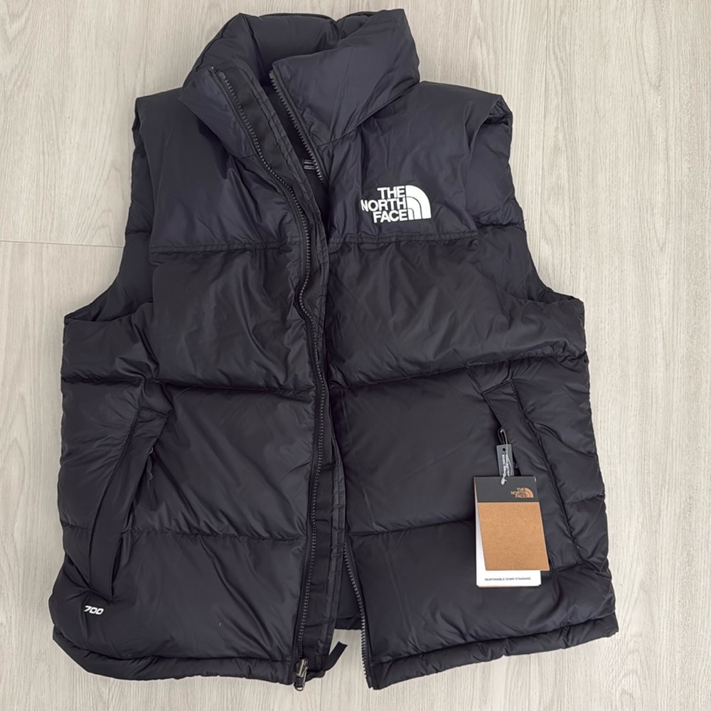 The North Face black puffer vest for men in black size Medium.